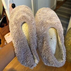 Well worn women’s regular house slippers
